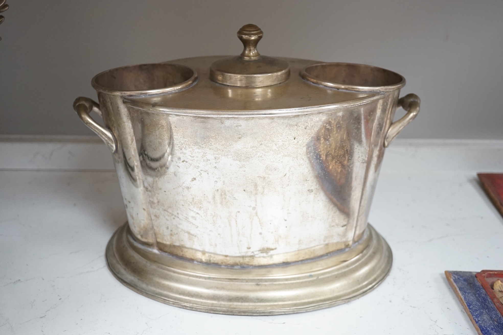 A collection of silver plated and metalware comprising two wine coolers, a tankard and a coaster, largest 29cm high. Condition - fair to good